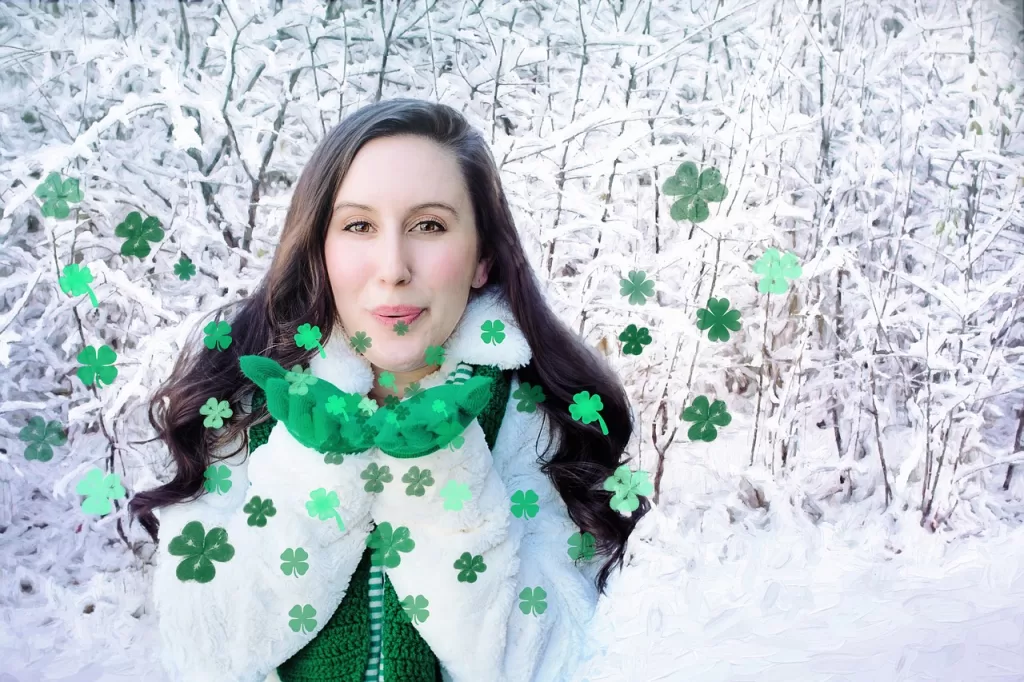 woman in the snow celebrating saint patrick's day
